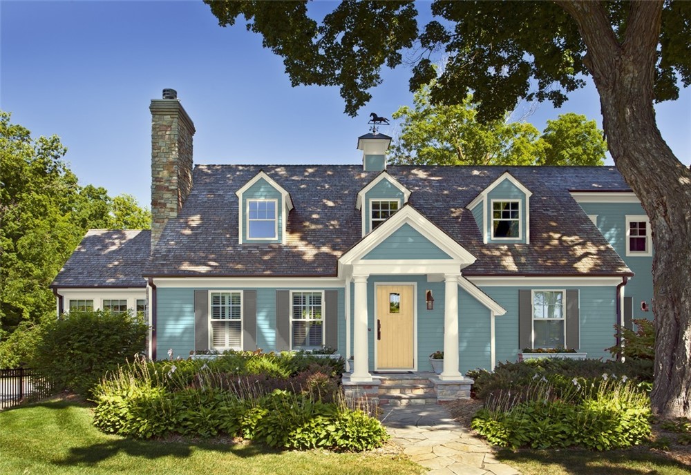 Cape Cod home in Benjamin Moore’s Aegean Teal, Kendall Charcoal, Lancaster Whitewash and Chestertown Buff
