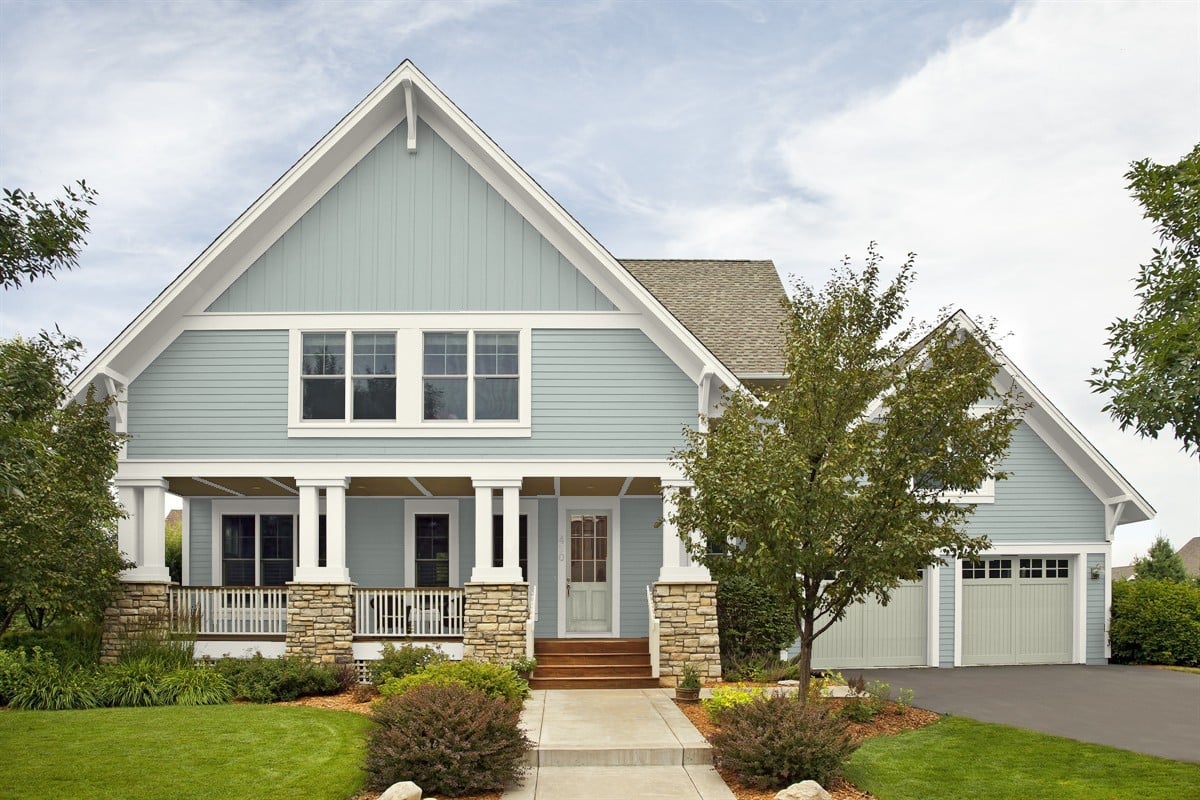 Home exterior with Benjamin Moore Beach Glass on siding and October Mist on front door and garage