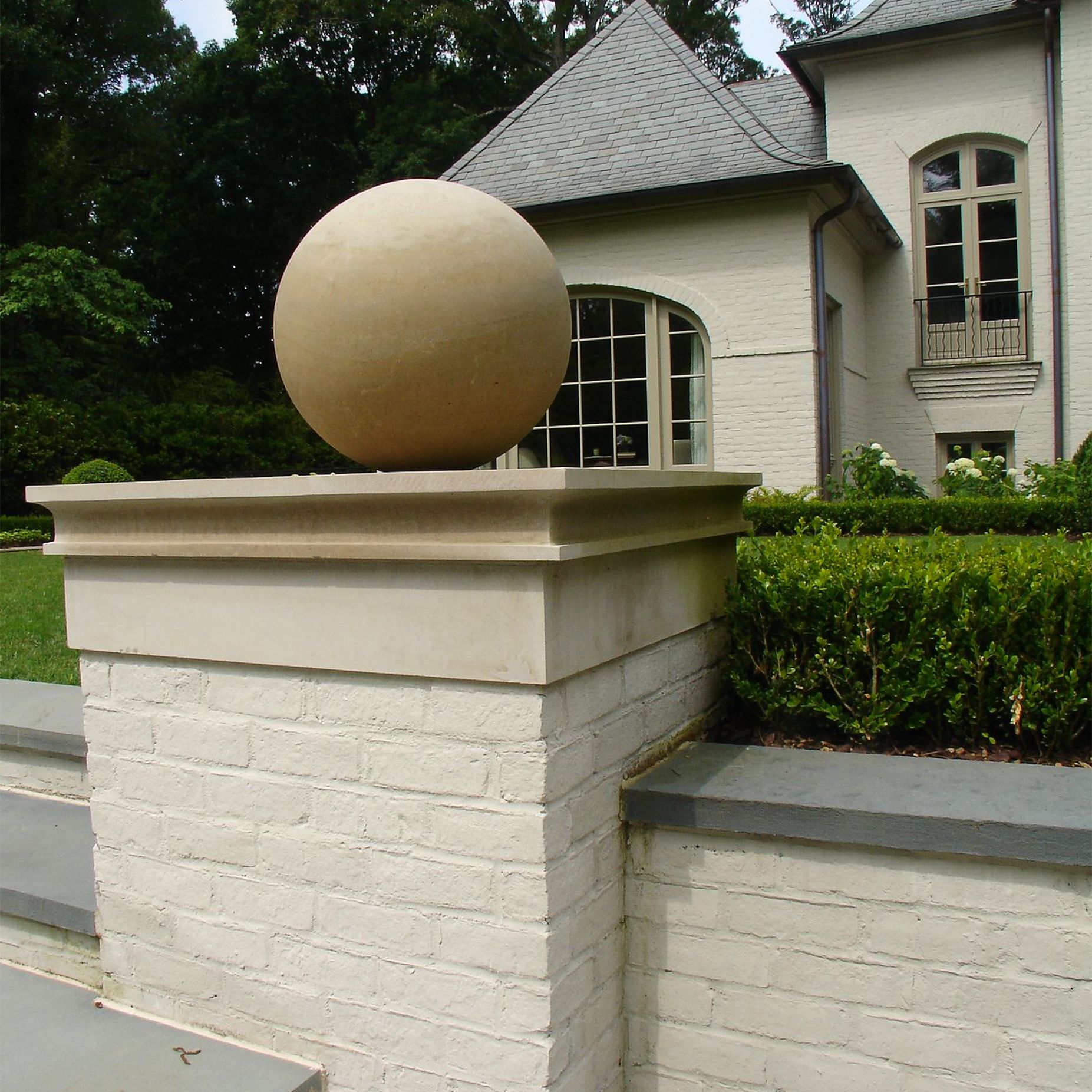 Riposo Beige Limewash on a brick garden wall