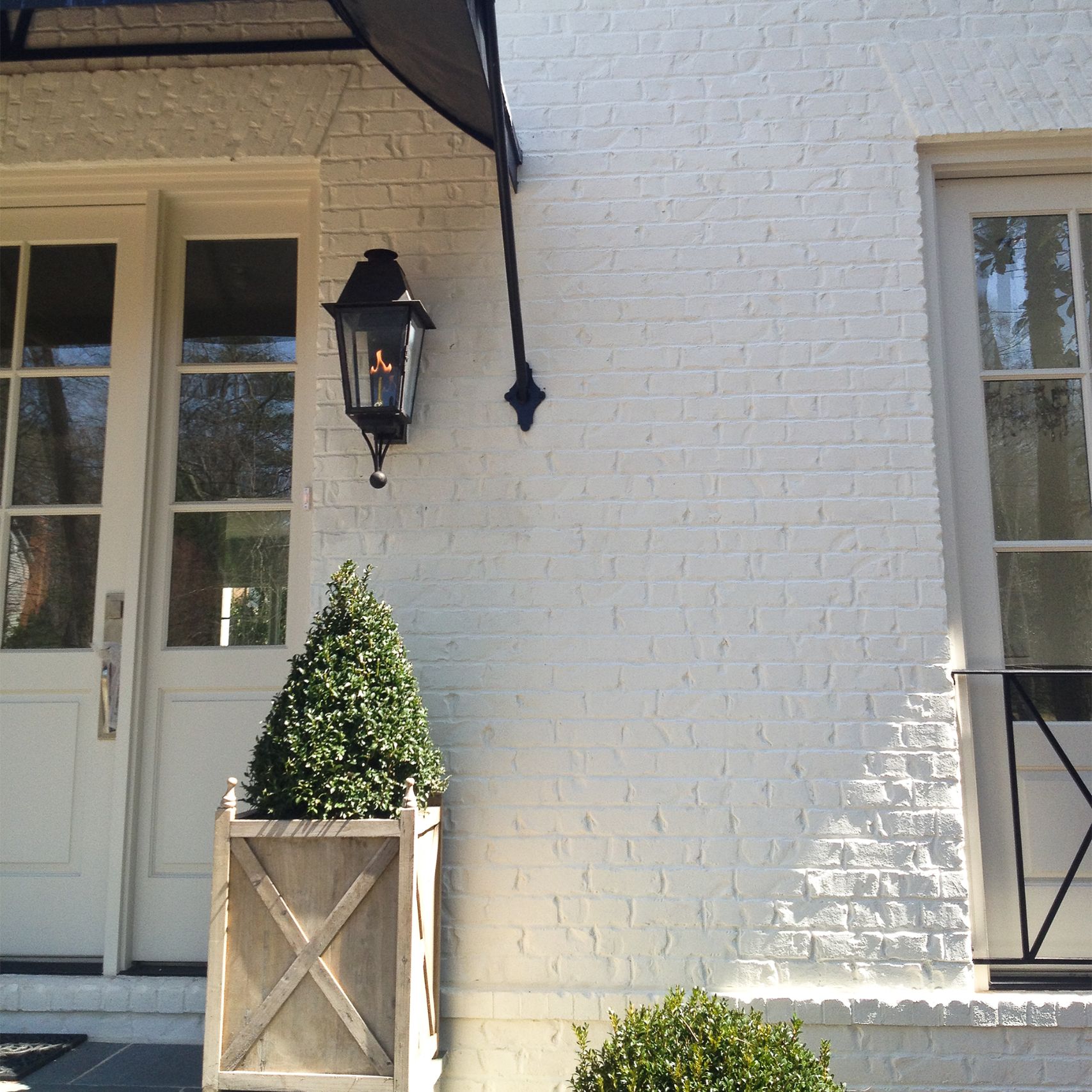 A solid application of Avorio White warms up a brick home