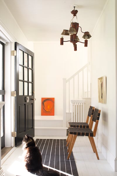 Entryway with Benjamin Moore Coventry Gray walls, stairs and trim in BM Super White; door in Black 2132-10