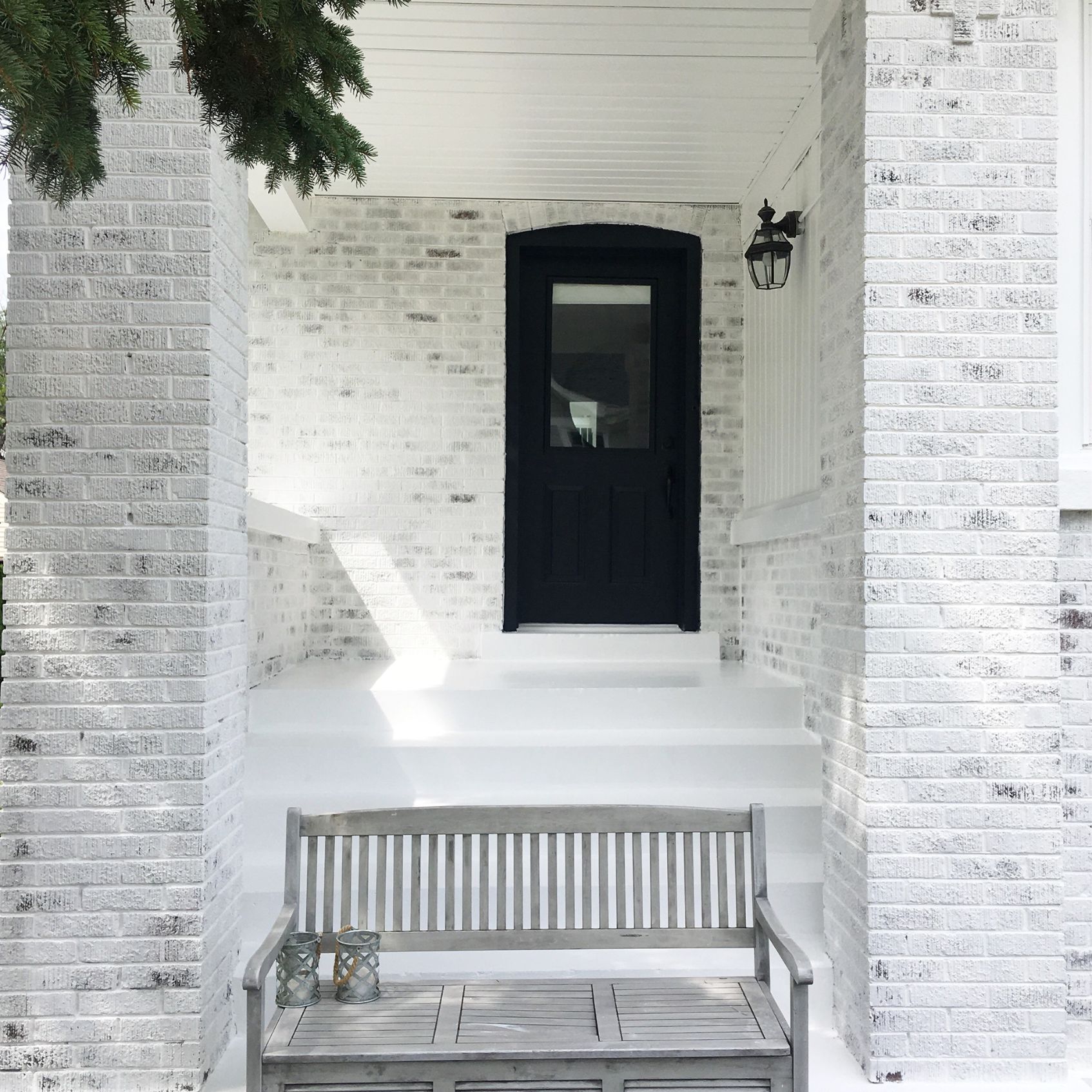 Brick home exterior with Bianco White Limewash complementing gray and black accents