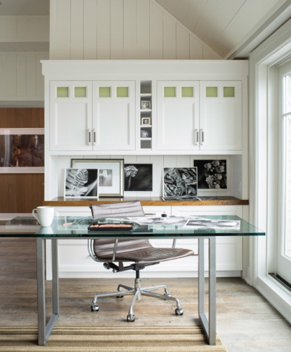 Benjamin Moore Simply White cabinets complement wood tones in an office