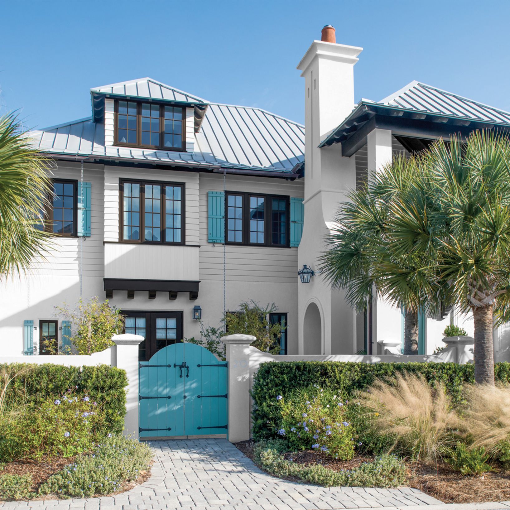 Brown Trimmed House with Turquoise Shutters