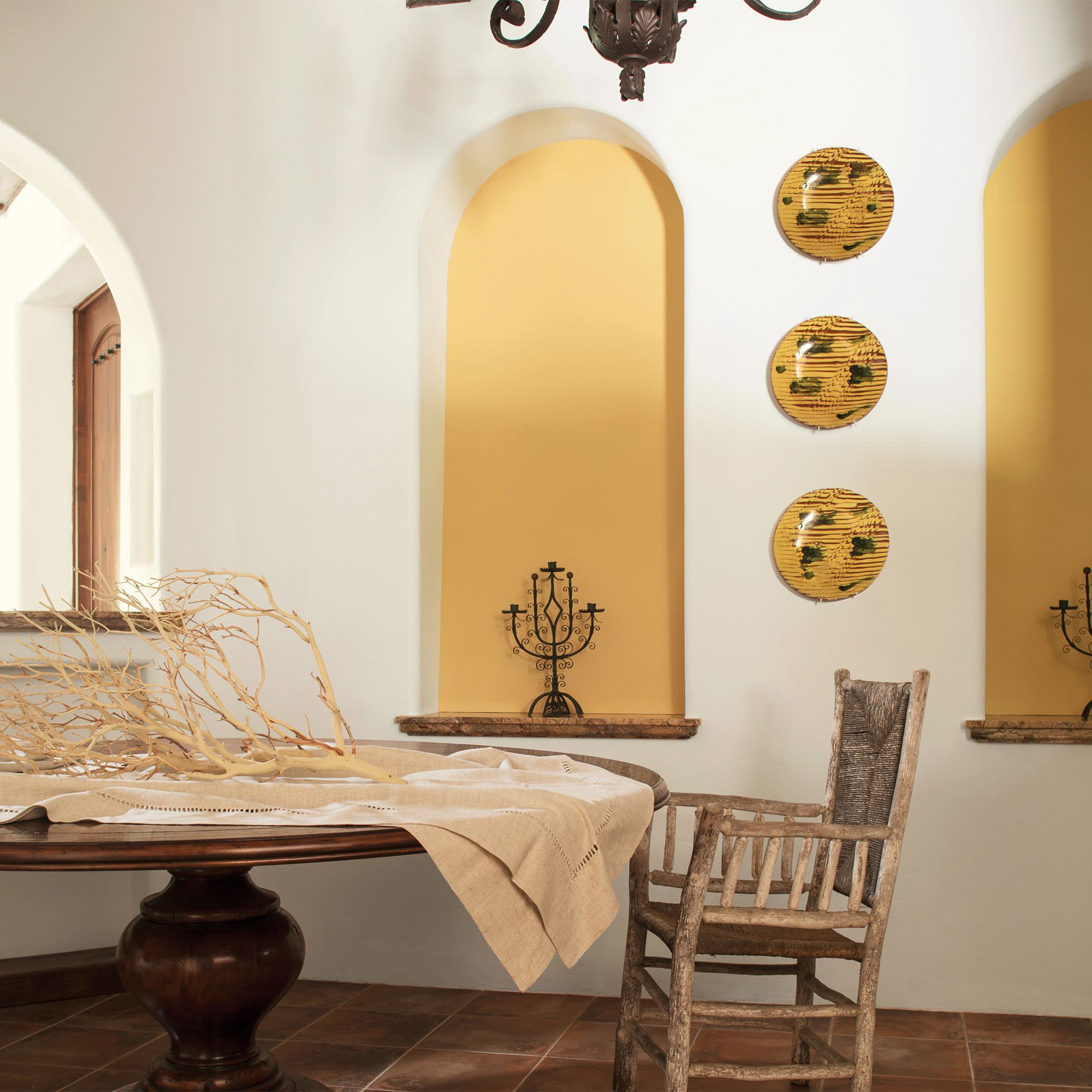 Yellow and White Dining Room with Chandelier