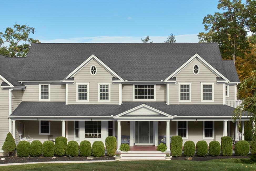 Exterior paint color in Benjamin Moore Revere Pewter with trim in Simply White