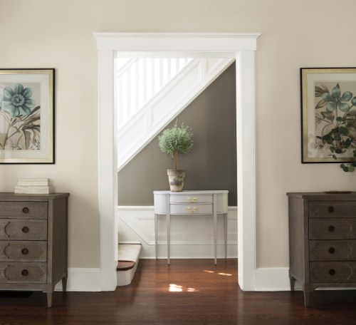 Revere Pewter living room walls with Decorator's White trim and Chelsea Graya on the stair wall