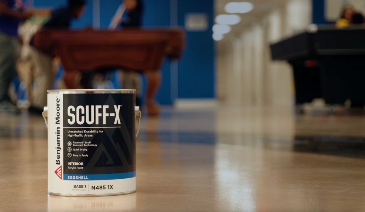 Picture of a Benjamin Moore Scuff-X paint can in a high-traffic school setting
