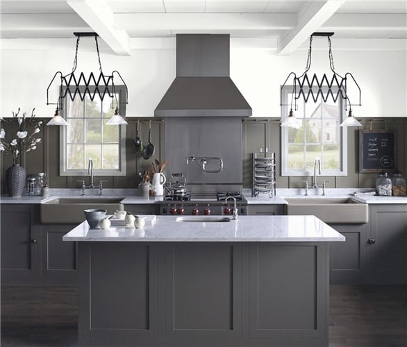 Benjamin Moore Super White on kitchen walls and enhances white quartz countertops and sleek appliances.