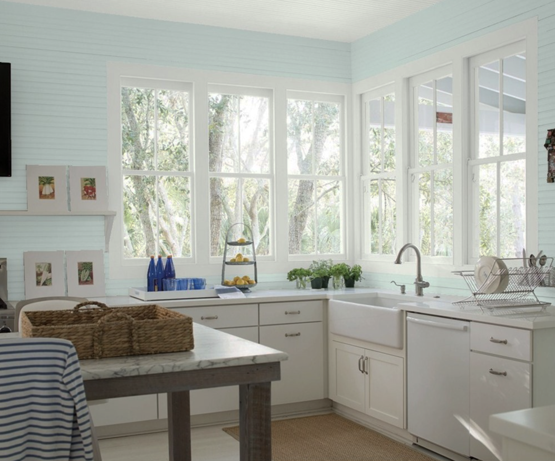 Brightly lit kitchen in Benjamin Moore Woodlawn Blue HC-147 with Ceiling and Trim in Paper White